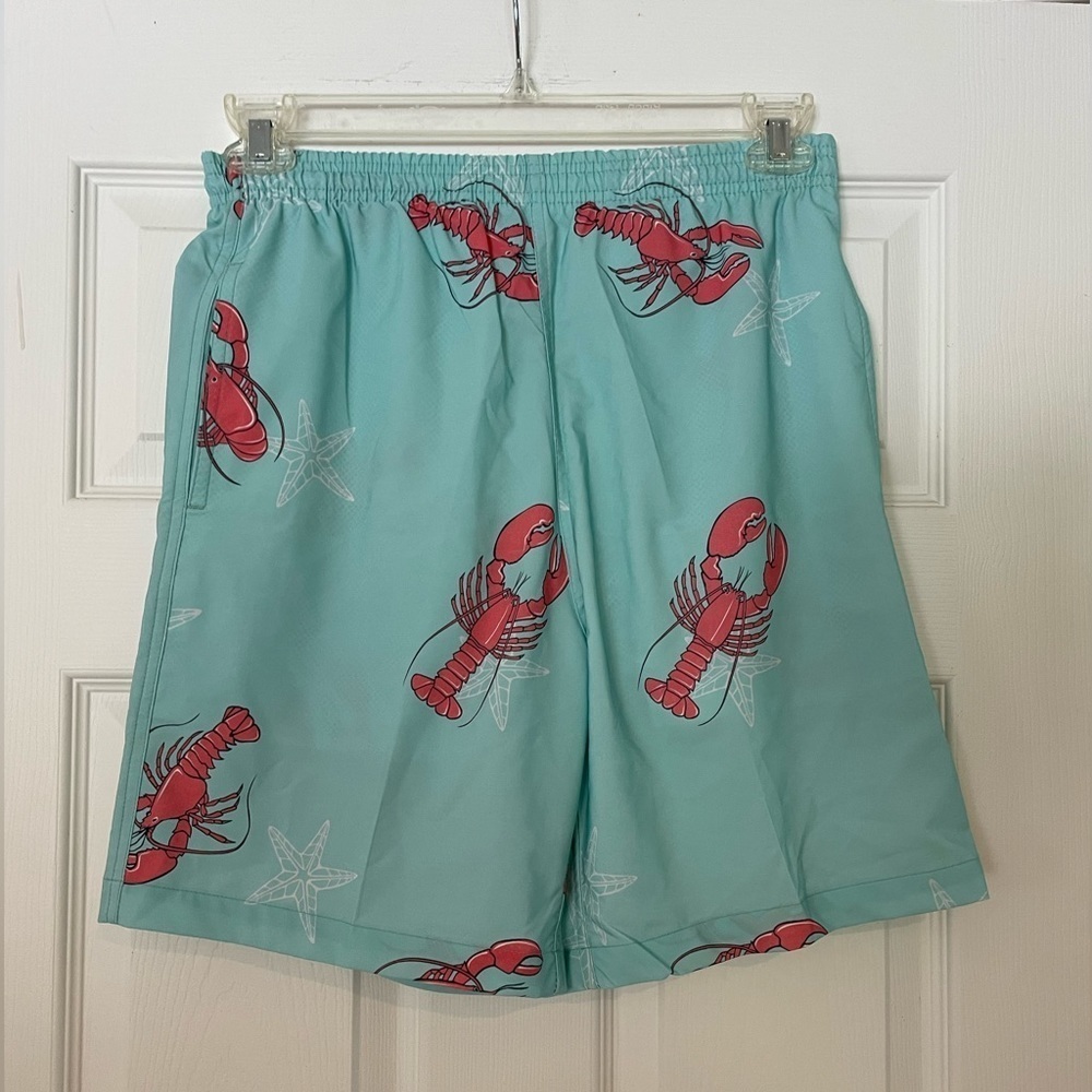 WEEKENDER men’s swim trunks in teal with lobster print